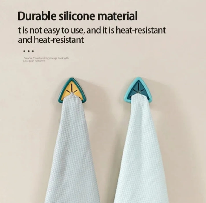 Adhesive triangular towel plug holders