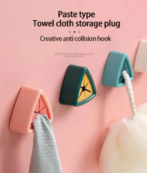 Adhesive triangular towel plug holders